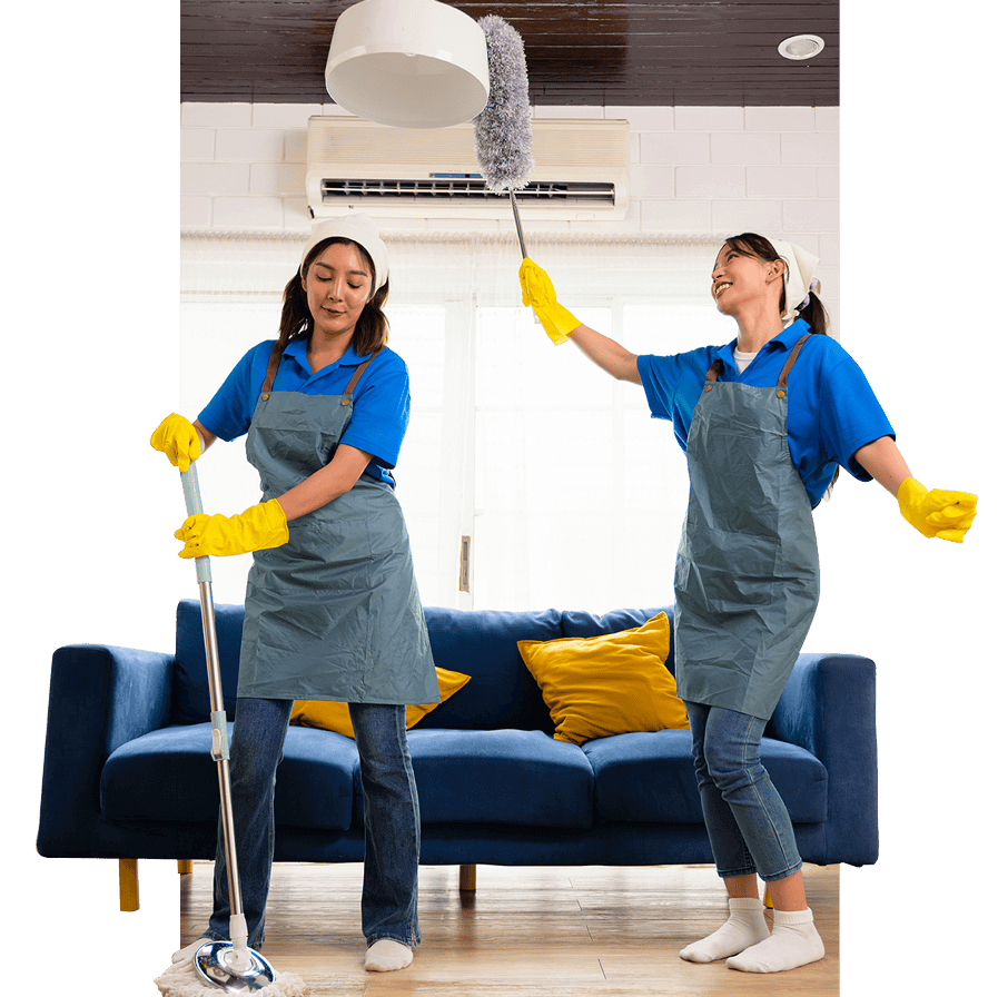 Two Queen B Cleaning & Disinfecting staff members in blue and yellow uniforms mopping and dusting to make an apartment fresh and clean.